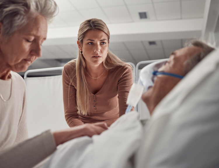 Family member visiting a catastrophic injury patient recovering in the hospital